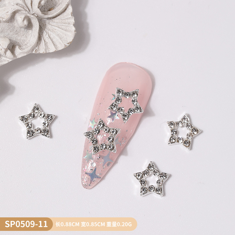 Venta caliente transfronteriza mariposa joyería de uñas aleación hueca alas de diamantes estrella de cinco puntas accesorios de decoración de uñas al por mayor