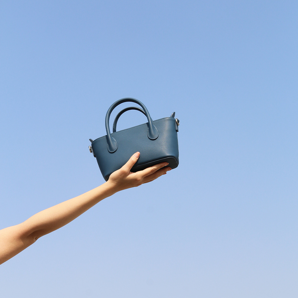 Bolso retro de gran capacidad para mujeres 2025 primavera nueva moda textura bolso de mano bolso de hombro de viaje universal