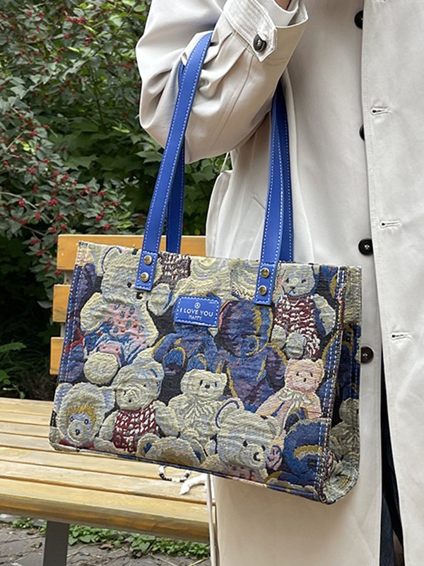 Bolsa de lona impresa de dibujos animados para mujeres 2024 nueva bolsa de gran capacidad, bolsa de hombro de viaje casual versátil