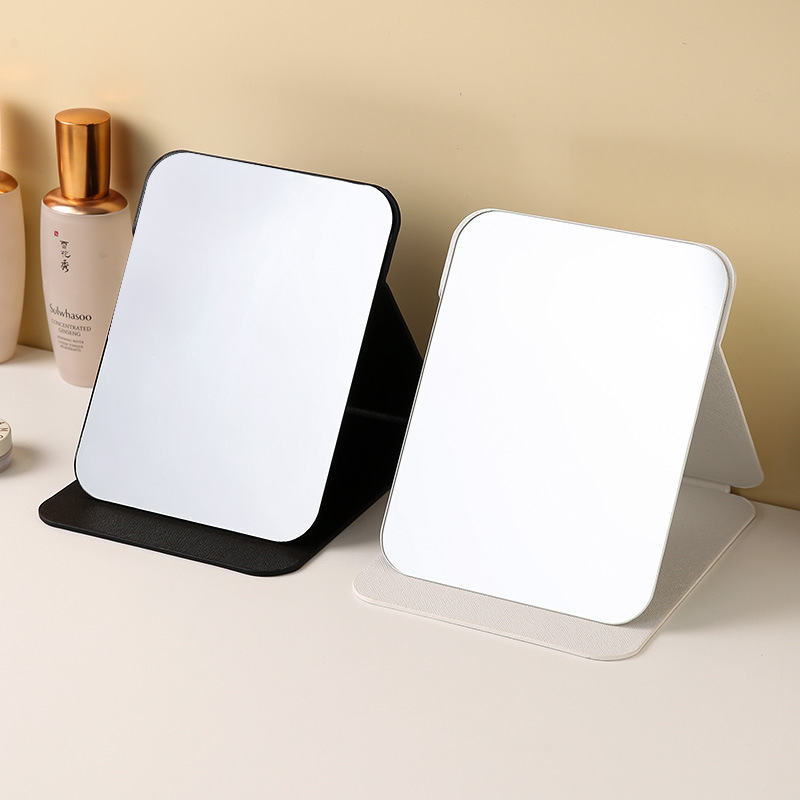 Espejo plegable de cuero PU Dormitorio de estudiantes Espejo de maquillaje de belleza de estilo princesa Espejo de tocador simple de escritorio para el hogar
