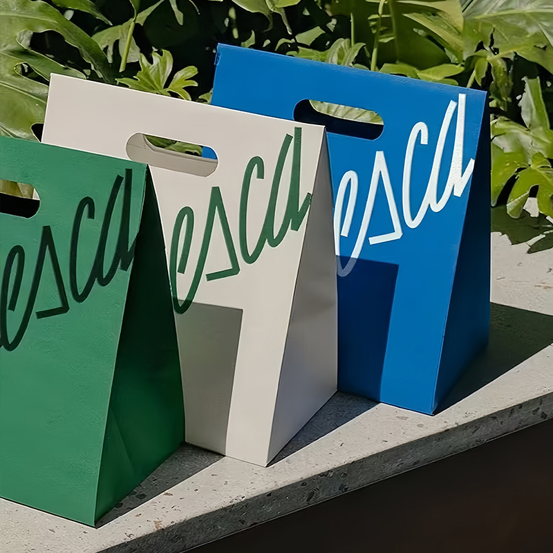 Bolsas de papel perforadas sin mango, bolsas de mano personalizadas para hacer logotipo, bolsas de regalo, empaque de compras de ropa de papel engrosado