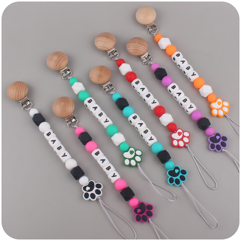 Nuevo bebé de dibujos animados de silicona perro garra mordedor creativo DIY bebé nombre mordedura chupete cadena anti-caída