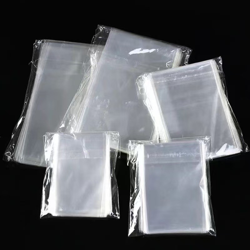 Bolsos planos al por mayor 100 bolsas de plástico bolsas de embalaje de caramelo transparentes bolsas de embalaje de joyería bolsas de embalaje OPP Bolsos planos