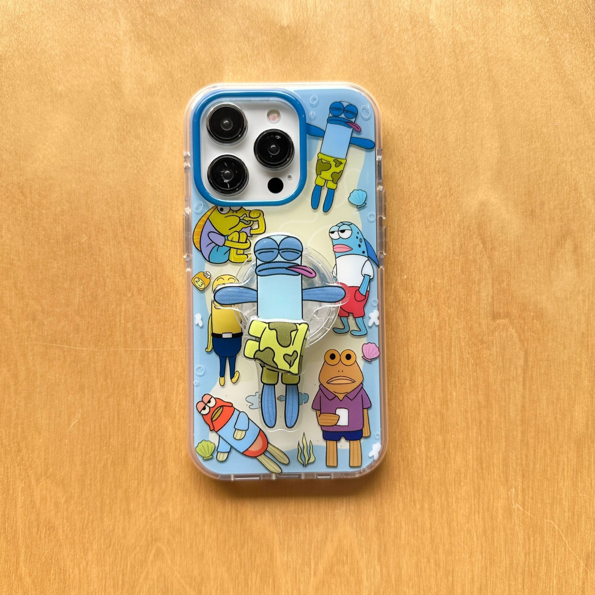 Divertido pez feo de dibujos animados para 16ProMax Apple 14 funda para teléfono móvil iphone15PM soporte giratorio 16 femenino 13