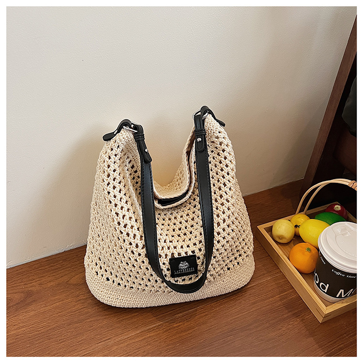 Summer hollowed-out knitted underarm bag for women, 2025 new style, laid-back and relaxed, seaside vacation style single-shoulder crossbody bag undefined