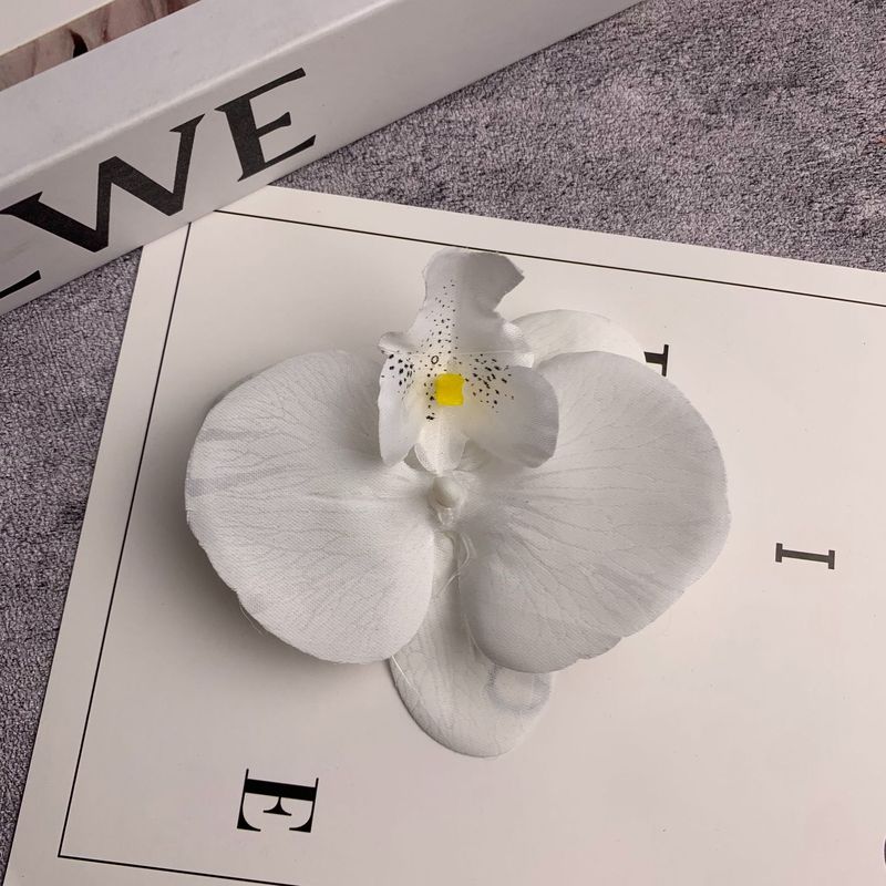 絹布の胡蝶蘭の花の頭は花の壁の部品の花の材料の頭をシミュレーションして髪を飾ってdiyの手作りの結婚祝いの贈り物を挟んで造花を飾ります。|undefined