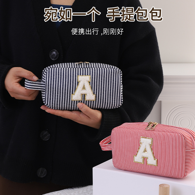 跨境新品旅行手提化妝包雪尼爾條紋的泡泡紗化妝包洗漱袋廠家直銷
