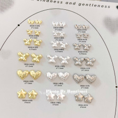 ネイルアクセサリーの新型蝶星愛シリーズの合金はシンプルで、豪華なネイルアクセサリーの高級な細いフラッシュです。