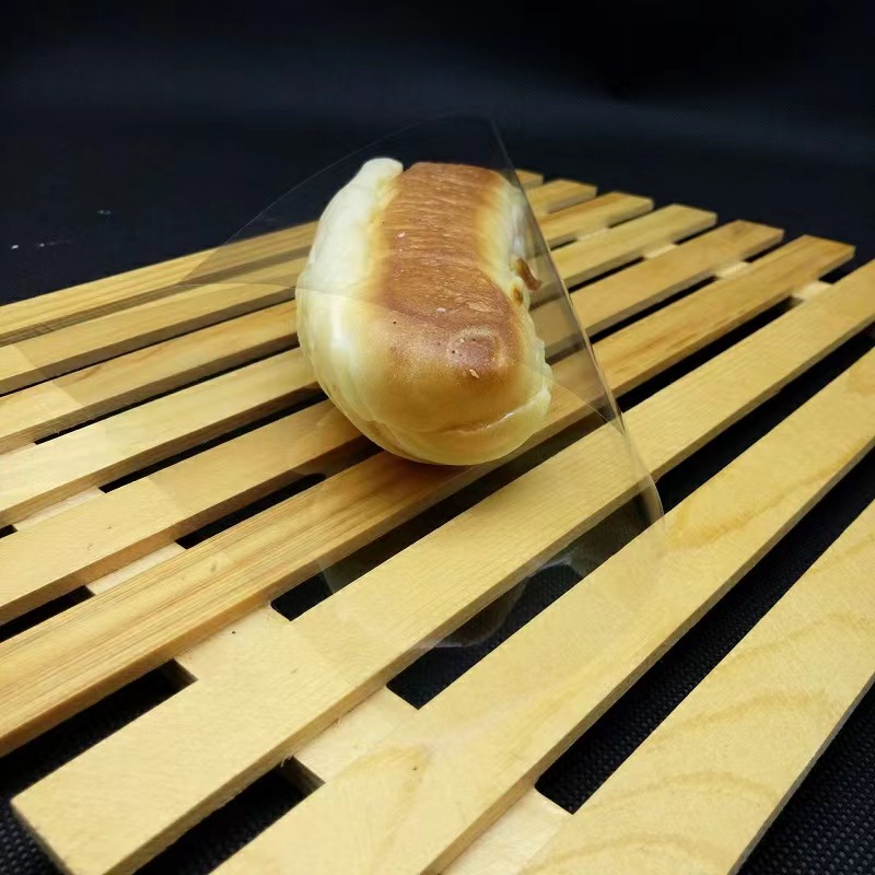 Food grade bread island cabinet cellophane baking plastic wrapping paper transparent paper pad single piece strawberry bouquet cake