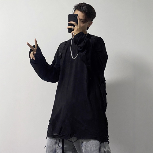 Basic shirt with a distressed hem, white long-sleeve T-shirt—men's Instagram-worthy high-street style for layering and edgy, stacked-look outfits.