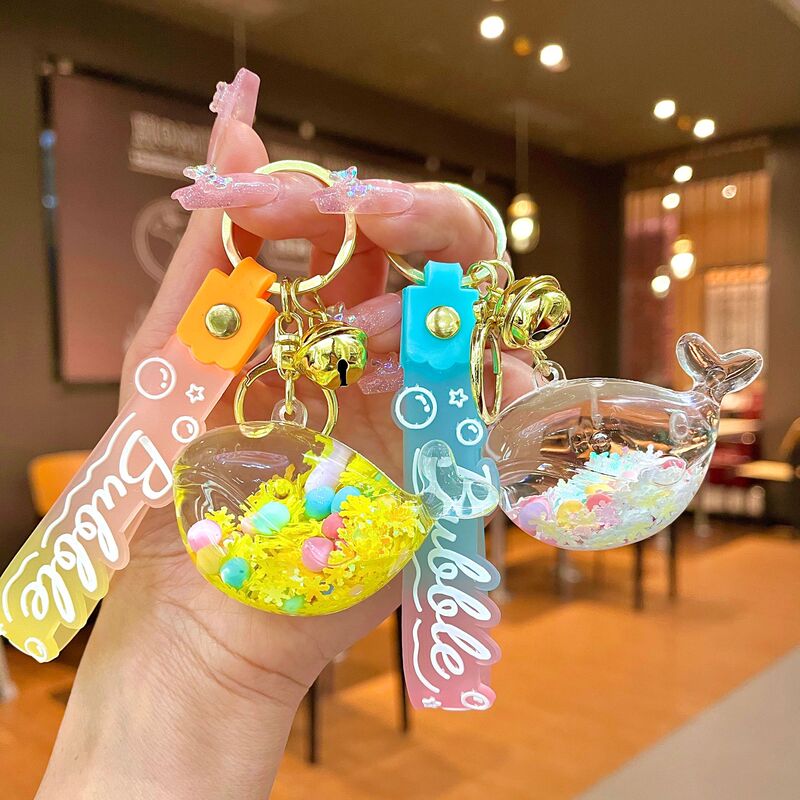 Oil-in quicksand bottle dolphin whale key chain luminous snowflake drift bottle exquisite children's school bag car small pendant