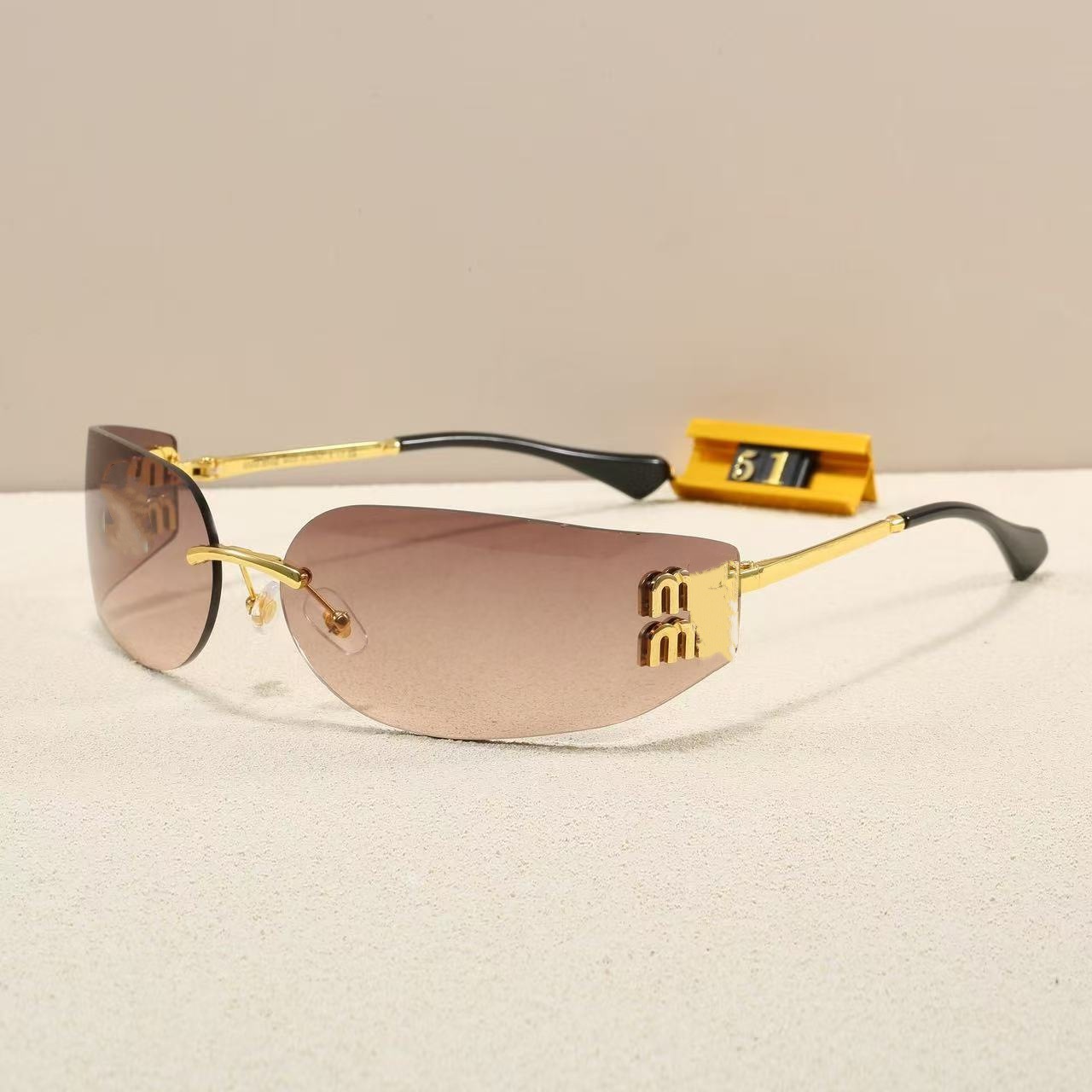 2026 Miu Miu New Frameless Integrated Style Xiaohongshu Same Model Curved Narrow Frame Sunglasses 51S Fashion Sunglasses for Women