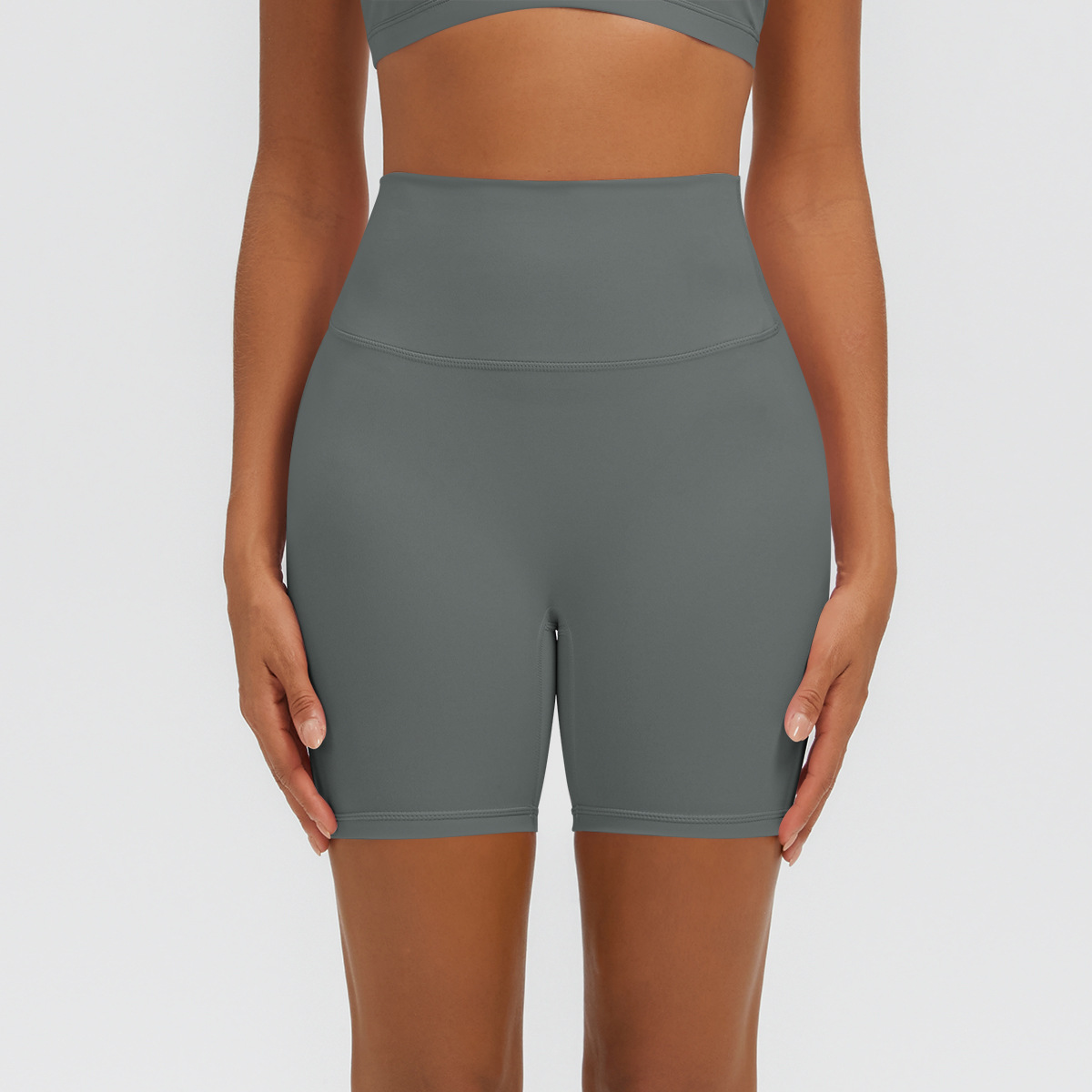 Nuevo tipo delgado de hielo, piel transpirable, ajustado, color sólido, ropa de yoga, pantalones cortos de tres puntos.