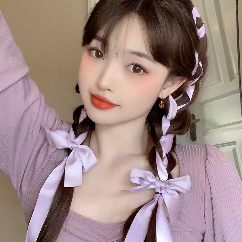 Girlish braided hairstyle with ribbon bows, boxing braids, double ponytails, holiday outing, hot girl hairstyle