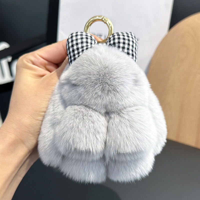 卸売りのかわいいウサギの毛の蝶結びの小さいウサギの自動車のキーホルダーはぬいぐるみのかばんを掛けて飾ります。