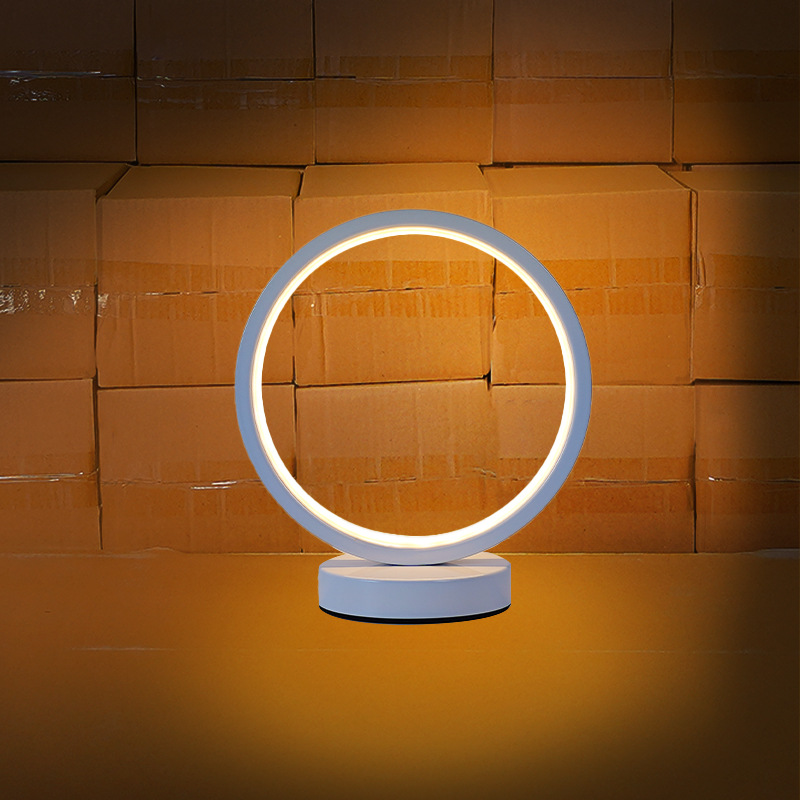 Lámpara de mesa LED nórdica creativa, luz ambiental circular para dormitorio, cabecera o decoración.