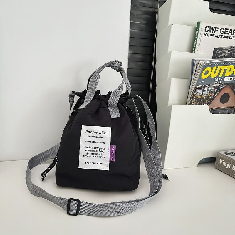 カジュアルでファッショナブルな女性用コインバッグ、カップル用ショルダーバッグ、トレンディな布製ポータブルバケットバッグ、男性用多用途クロスボディバッグ|undefined