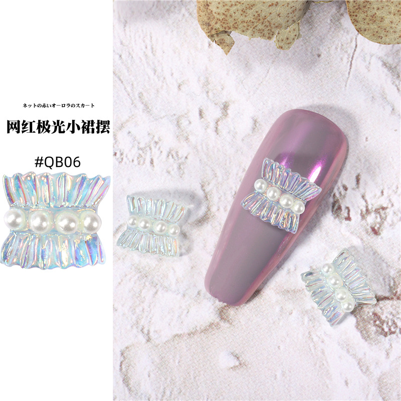 Accesorios de falda de arte de uñas 2021 nueva celebridad de Internet pequeño libro rojo estilo caliente hada aurora falda plisada decoración de uñas