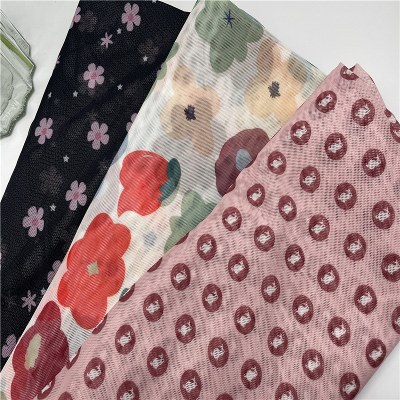 泫雅风网纱印花防晒衣面料 2025新款氨纶弹力网布数码印花布经编