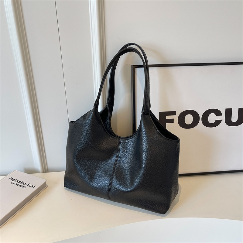 Bolsa de cuero suave transfronteriza para mujeres de gran capacidad 2025 nueva bolsa de hombro simple de textura casual