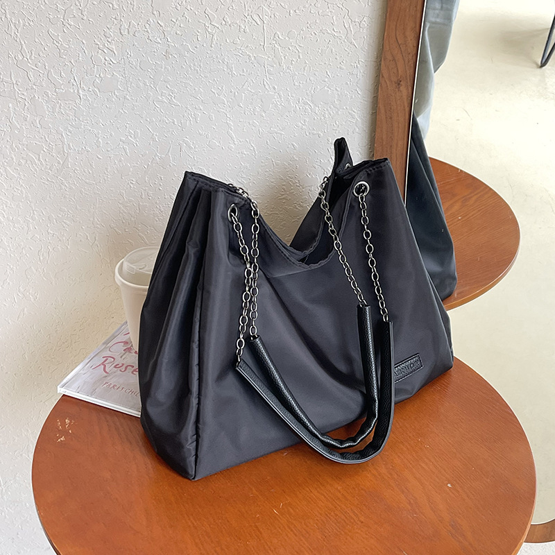 Bolso de mujer 2026 nuevo bolso de mujer bolso diario bolso de gran capacidad bolso de transporte bolso de textura cadena mochila