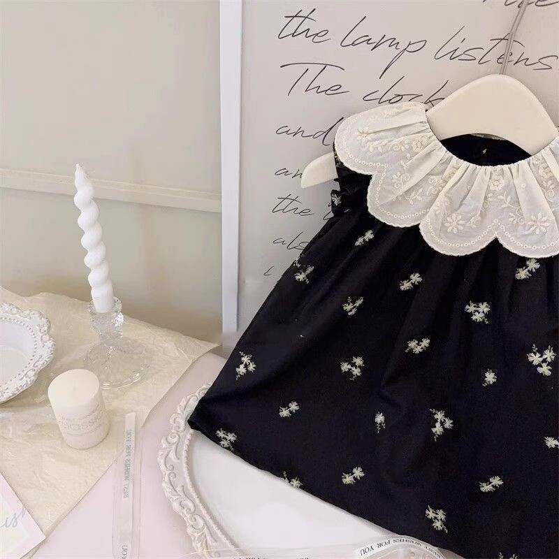 Xianning siete ropa para niños coreanos verano nuevo estilo bordado cuello de hoja de loto vestido floral negro falda chaleco sin mangas para niñas