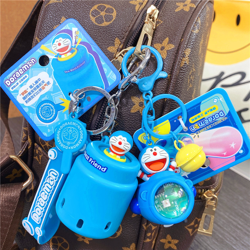 Genuine Doraemon surprise pirate bucket keychain Tinker Bell spaceship lantern Mouse Machine key chain pendant