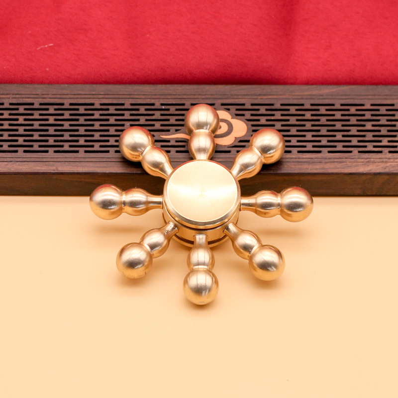 Brass spinning top for finger
