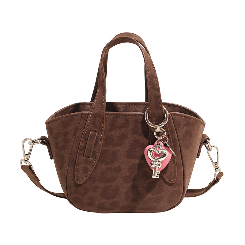 Retro nicho leopardo bolso de cubo de mujer otoño invierno 2025 nuevo tipo de bolso de cestas de verduras de mano bolsa de hombro casual mochila moda