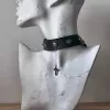 Кожа с металлическими заклёпками и крестом