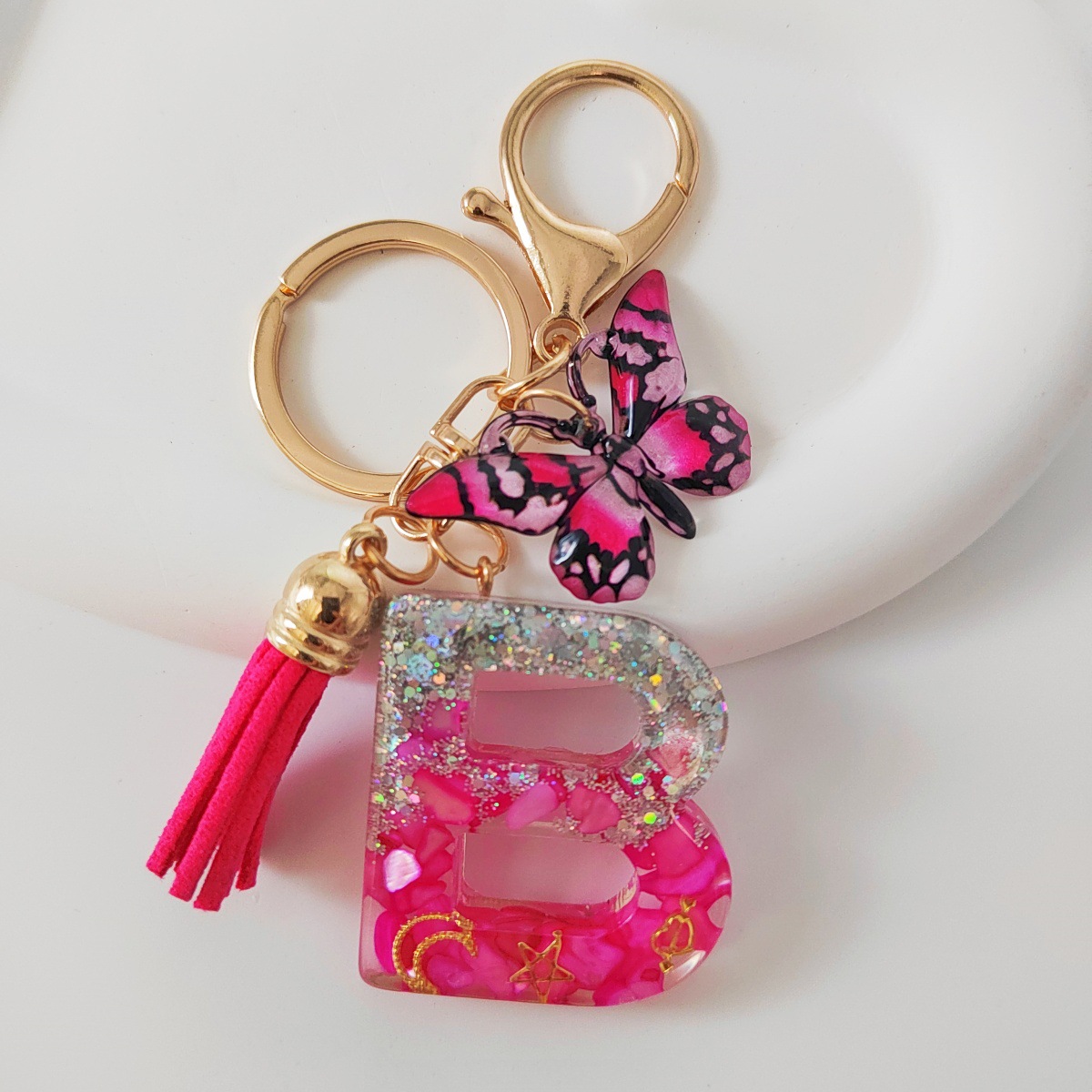 Inventario transfronterizo nueva resina bicolor mariposa borda llavero colgante estrella luna accesorios de joyas