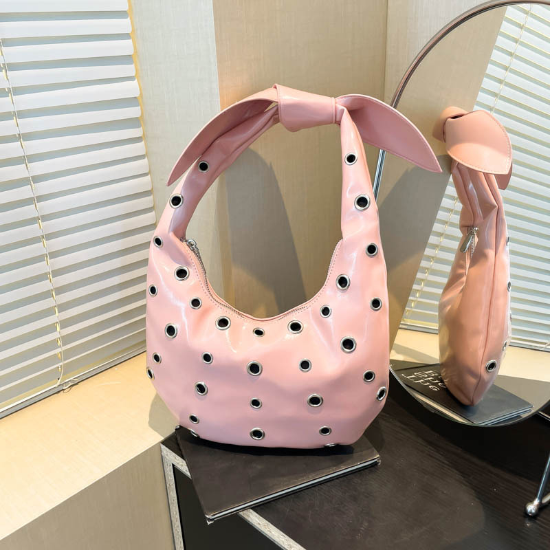 Bolso de axila con textura transfronteriza 2025 verano nuevo bolso femenino cielo estrellado agujero agujero bolso de hombro con remache hueco