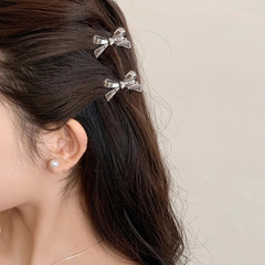 甘いクールな蝶結びの金属の小さいサイズのヘアピンの女性のサイドクリップの額の無痕の前髪の砕毛クリップの髪飾り