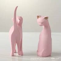 Очаровательный кот slain? (надо корректно)" - The original: "Enchanting Cat Slaying Creative Office Desktop bedroom Living room decoration room Forming a new home wedding gift". We should translate gracefully: "Очаровательная кошка, убийство?" This seems mistranslated. Perhaps intended: 