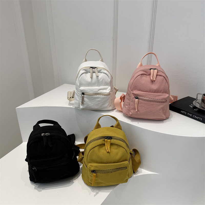 Mochila mini 2026, estilo japonés y coreano, informal, de lona, para estudiantes, de color sólido, versátil, para tabletas