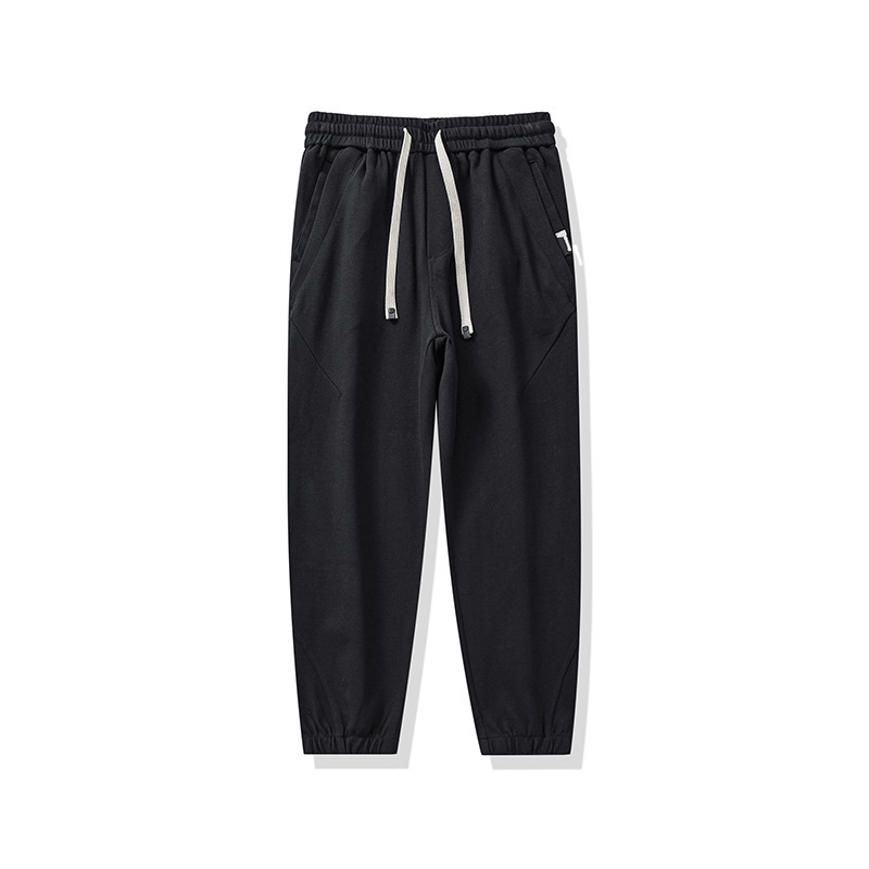 Pantalones casuales pesados negros para hombres sueltos 2025, nuevo otoño y invierno, pantalones deportivos gruesos con marca de algodón colgante