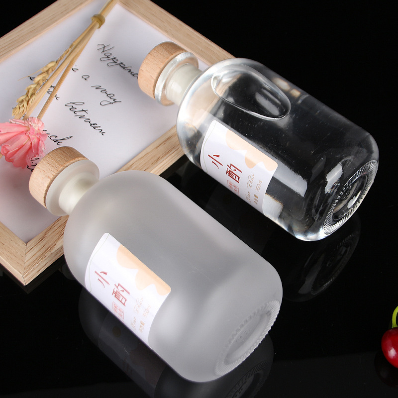 Botella de vidrio esmerilado transparente al por mayor botella de vino de fruta casera de cerveza botella de vino vacía botella de vodka botella de vino de ciruela cubierta de madera