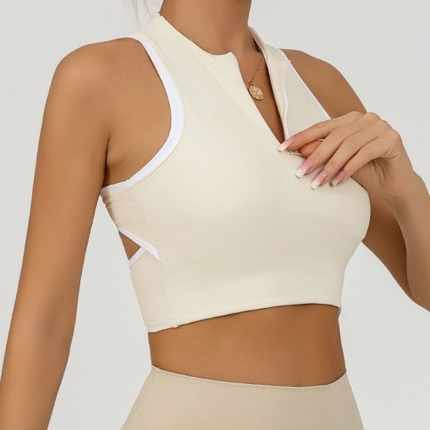 Chaleco de yoga deportivo europeo y americano personalizado para mujer con cremallera envuelta en el pecho a prueba de golpes y contraste de color fitness de secado rápido