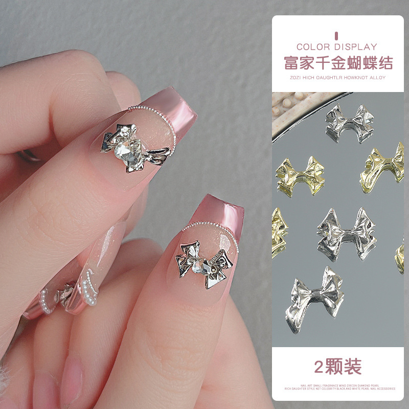 En línea manicura celebridad Fujia Qianjin dragón corazón arco 2023 nueva aleación luz lujo estilo Chanel decoraciones de uñas