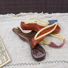 Factory-direct hardwood slingshot with nostalgic design—perfect for outdoor fun! Wooden slingshot frames and toys for kids, available wholesale.