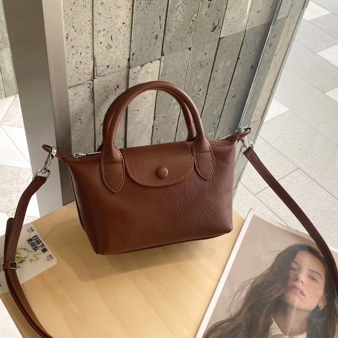 Bolsos femeninos 2024 nuevos bolsos femeninos de cuero de alta costura de moda 100 bolsos correccionales para viajeros de nicho bolsos portátiles