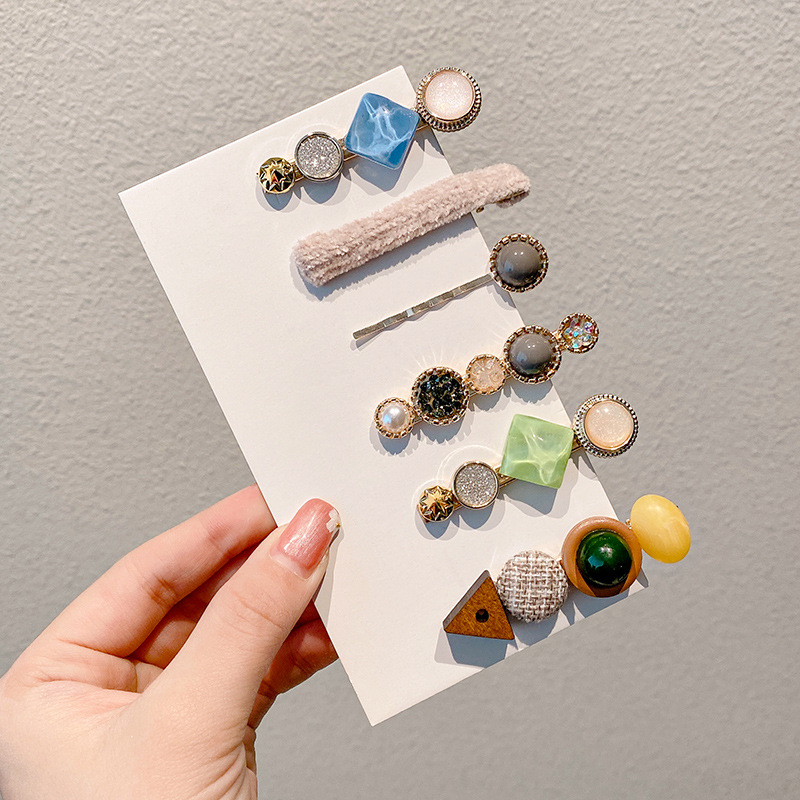 Clip de flequillo lateral rojo de la red femenina 2025 nueva horquilla simple clip de una línea horquilla clip de cabello roto tocado clip de pico de pato