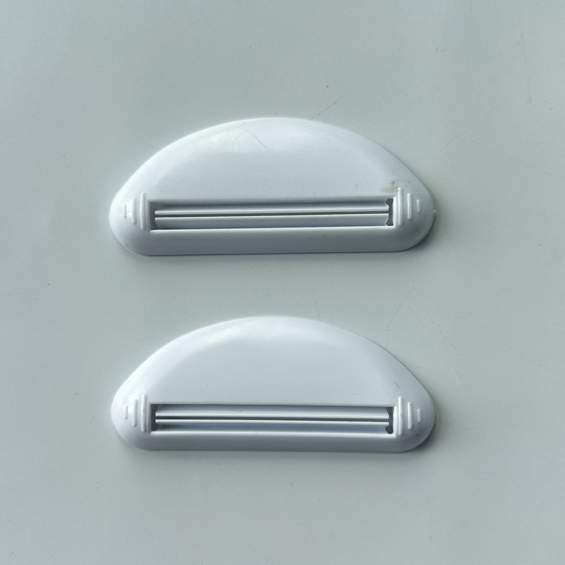 Grenzüberschreitender, versandfertiger manueller Quetscher, Spender für Gesichtsreiniger, Zahnpastaclip, kreatives Quetschwerkzeug_voghion.com