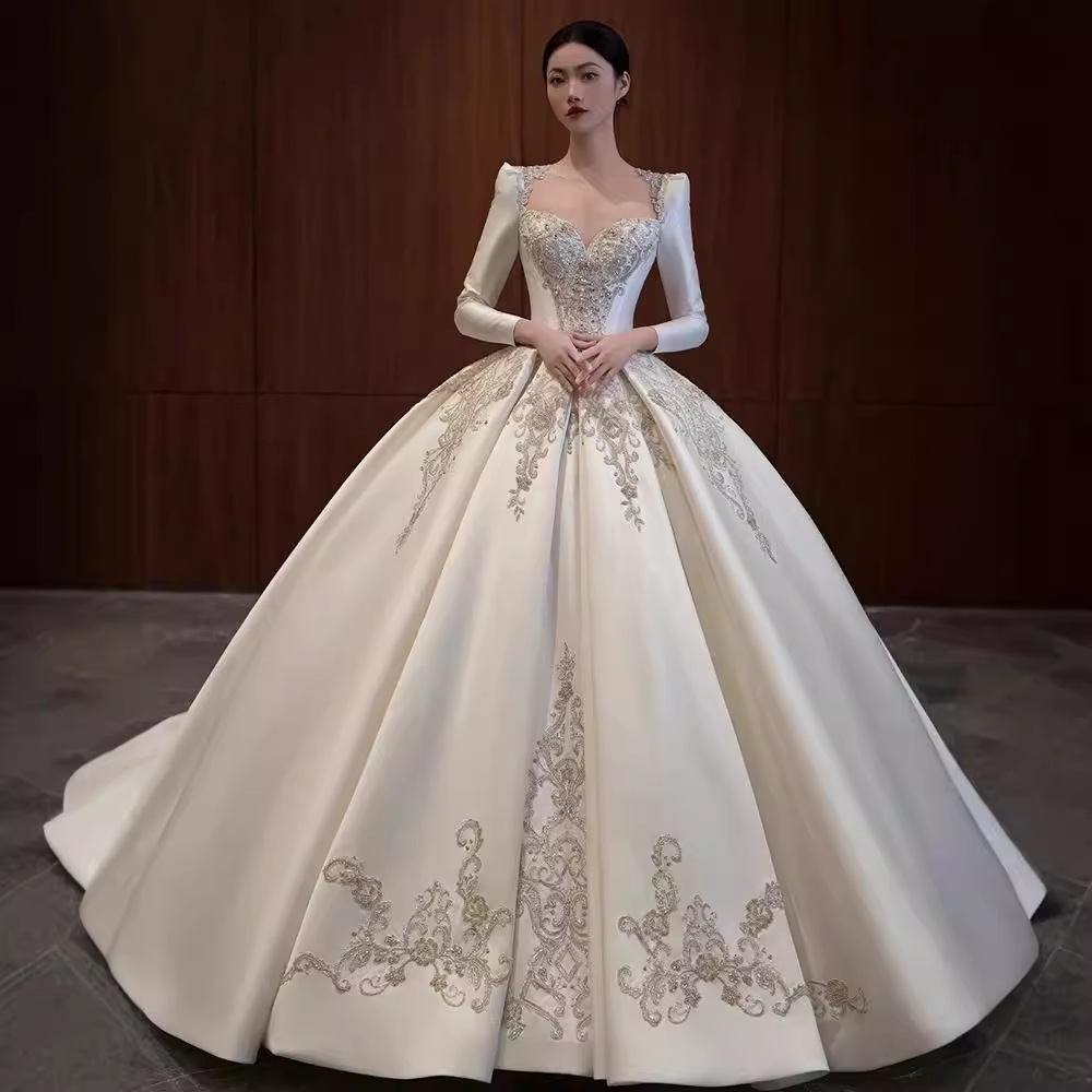 Vestido de novia de satén texturizado de alta gama, estilo invierno 2026, de manga larga, estilo princesa, con cola, de lujo, estilo francés.