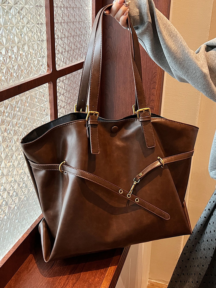 Bolsos de mujer Bolsos de alta capacidad portátiles de todo fósforo 2025 nuevo estilo retro moda casual bolso de hombro sentido bolso de mujer