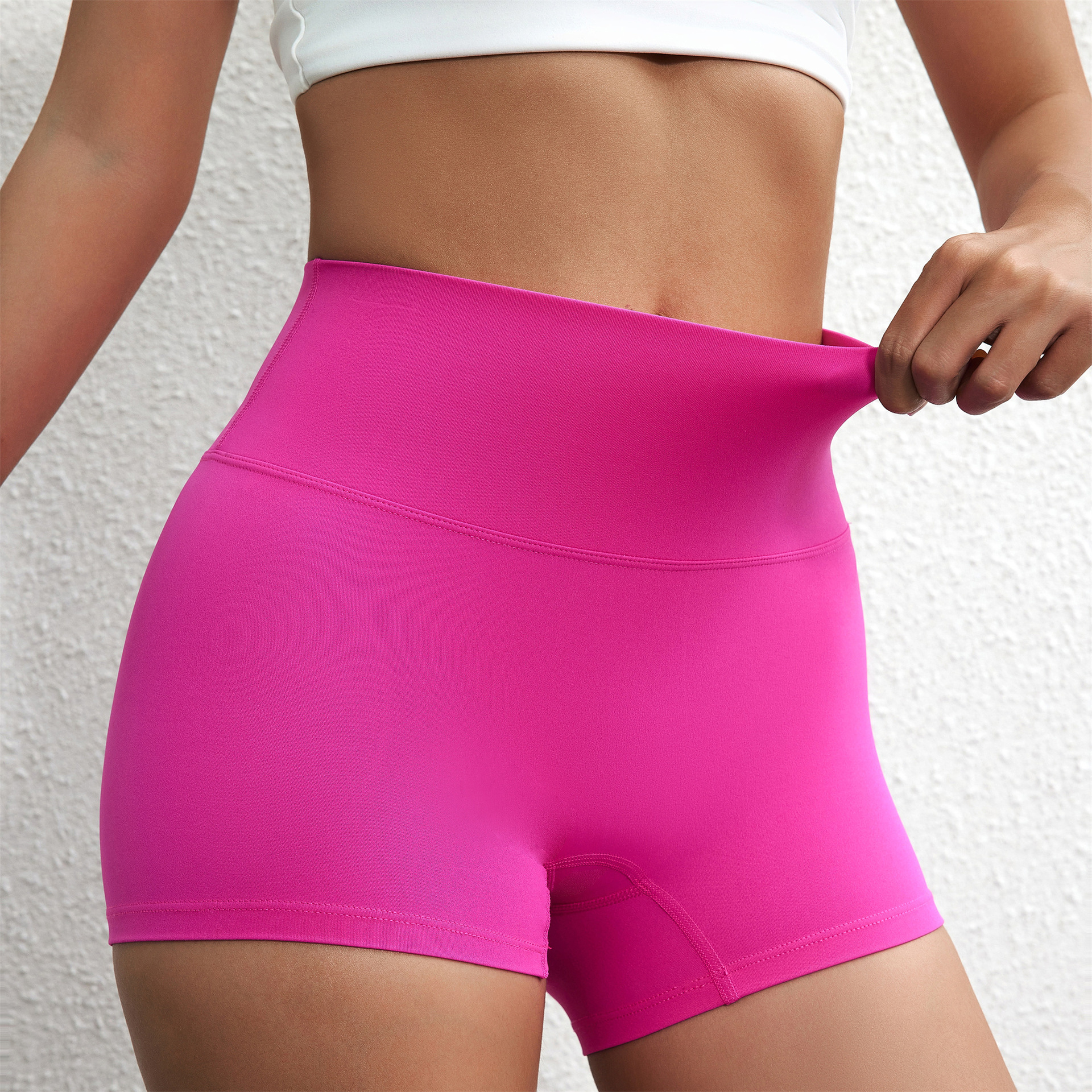 Summer solid color European and American women's high waist hip lifting peach sports shorts tight stretch fitness three pants can be worn outside