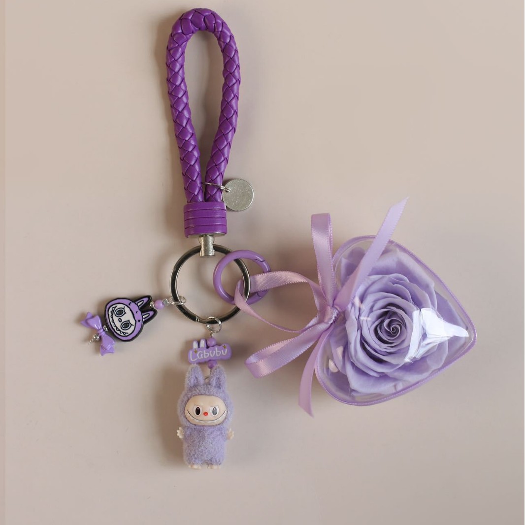 보라색 웃는 천 열쇠고리
