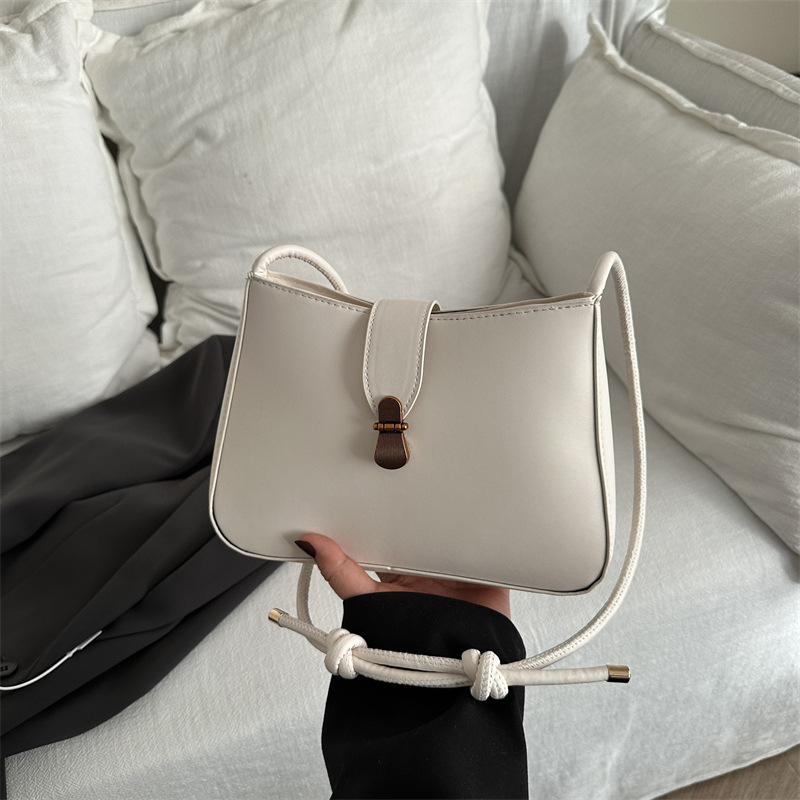 Bolsa de brazo retro para mujeres 2025 primavera nueva bolsa de moda pequeña bolsa de viaje coreana simple bolsa de hombro extranjera