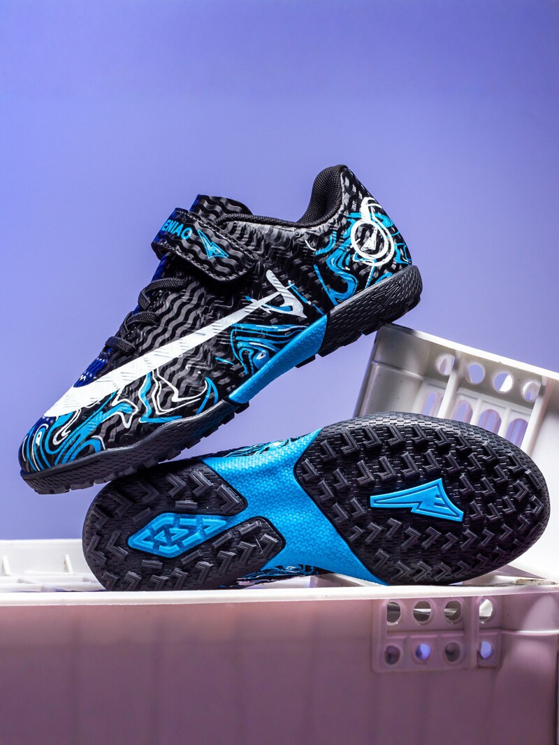 Zapatos de fútbol transfronterizos de alto perfil para hombres TF zapatos de entrenamiento antideslizante transpirables para niños zapatos deportivos profesionales para estudiantes