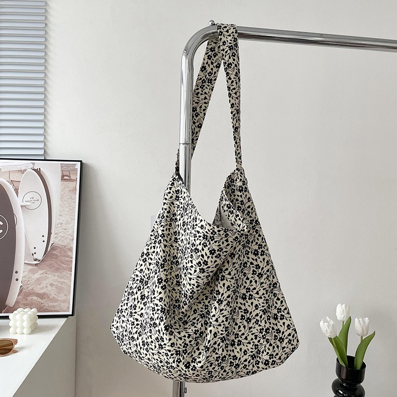 Diseño nicho bolsas de lona para mujeres 2025 nueva gran capacidad coreana estampado de leopardo flor de hombro impresa bolsas de mujer